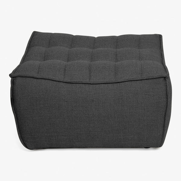 Contemporary square pouf with textured dark fabric upholstery and tufted cushion top.