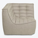 Modern, compact armchair with tufted backrest and plush pattern.