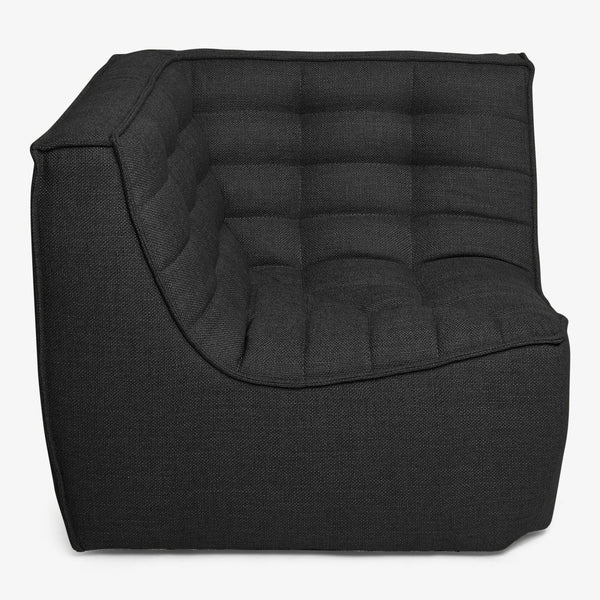 Contemporary black armchair with quilted design offers stylish comfort.