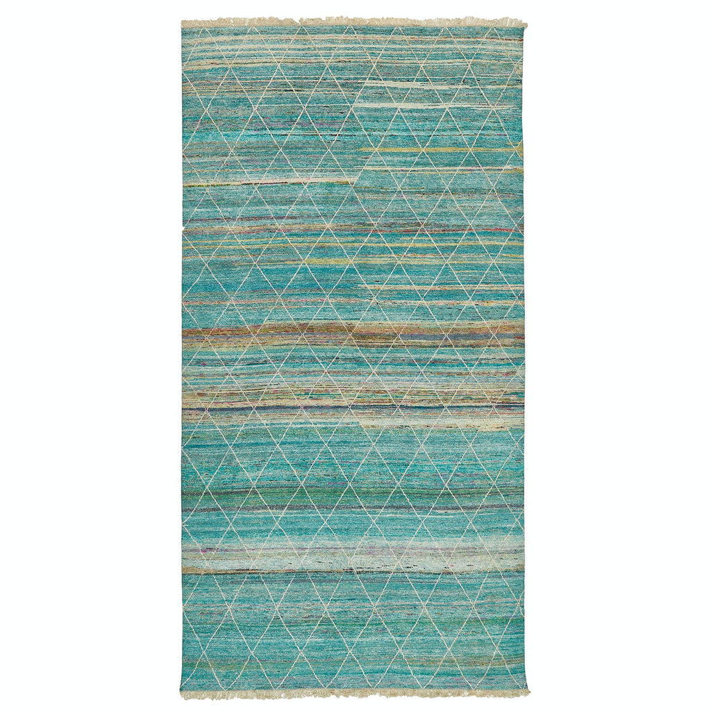 Rectangular rug with distressed blue and beige pattern, fringed edges.