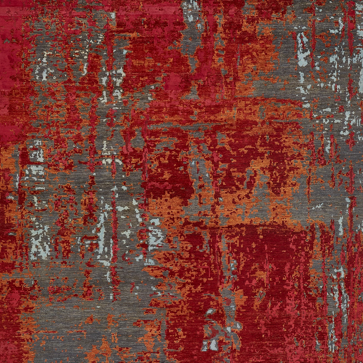 Abstract rug design with red, gray, orange, and cream patches.