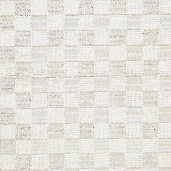 Close-up of textured fabric with checkerboard pattern, neutral color palette.