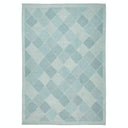 Contemporary diamond-patterned rug in shades of blue creates a calming atmosphere.