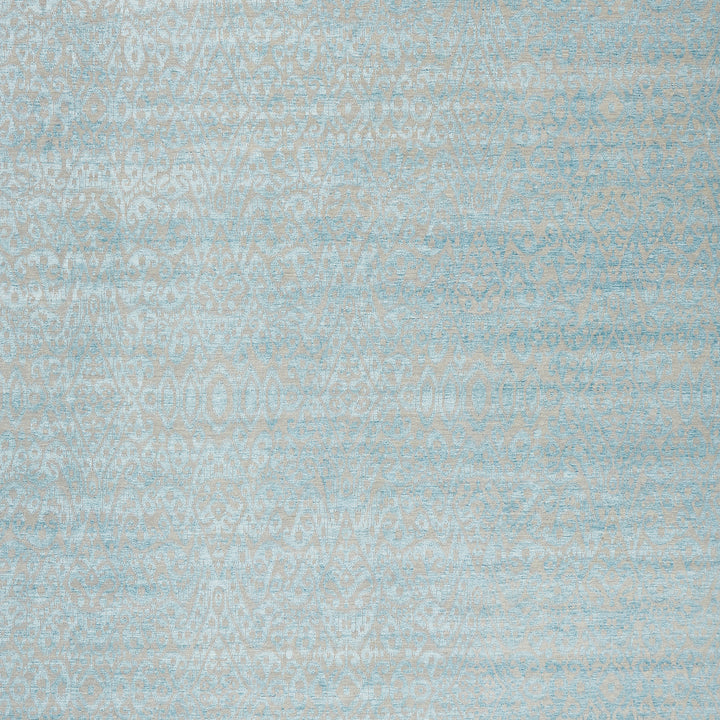 Delicate and elegant paisley-inspired fabric with soft blue hues.