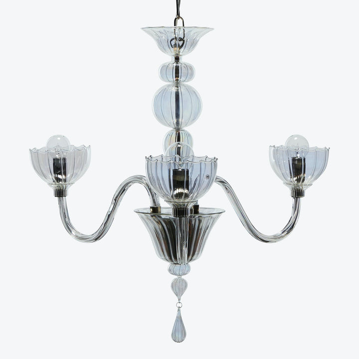 Elegant chandelier with transparent glass elements and floral light fixtures