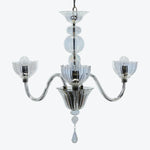 Elegant chandelier with transparent glass elements and floral light fixtures