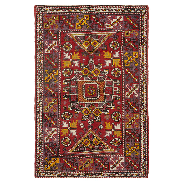 Traditional handmade rug with intricate geometric design and rich color.