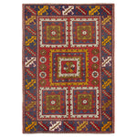 Intricate hand-woven oriental rug with geometric patterns and floral motif.