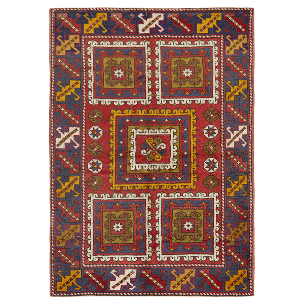 Intricate hand-woven oriental rug with geometric patterns and floral motif.