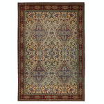 Ornate, symmetrical rug with intricate floral motifs in muted colors.