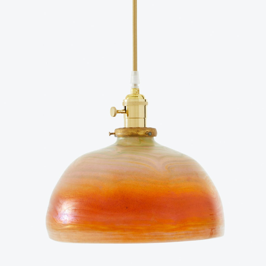 Vintage-style pendant light with swirling orange and yellow lampshade.