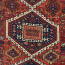 Close-up of handmade, traditional rug with intricate geometric pattern