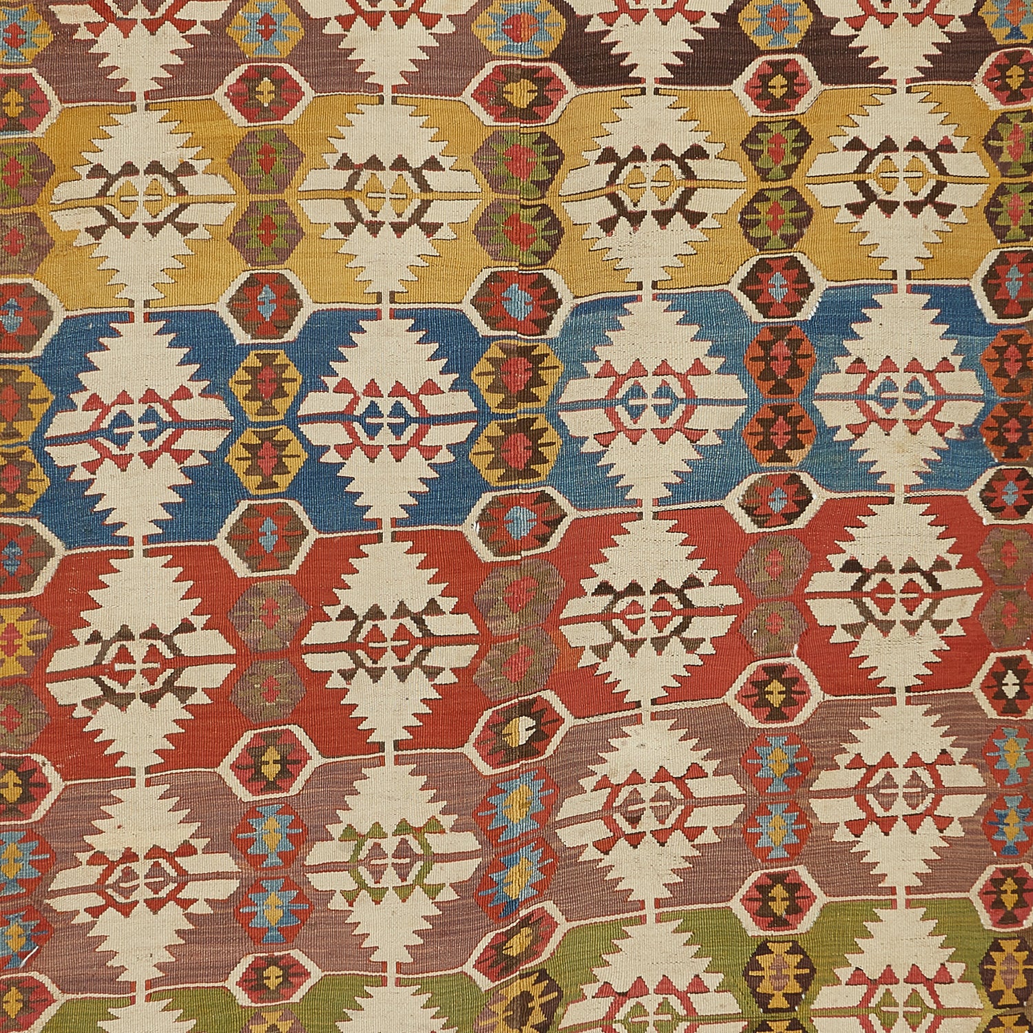 Close-up of a vibrant, symmetrical fabric with intricate geometric patterns.