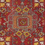 Intricate and symmetrical Oriental rug showcasing rich red color and geometric motifs.