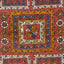 Intricate handwoven rug showcases rich colors and geometric embellishments beautifully.