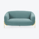 Contemporary teal sofa with sleek design and elegant metallic legs.