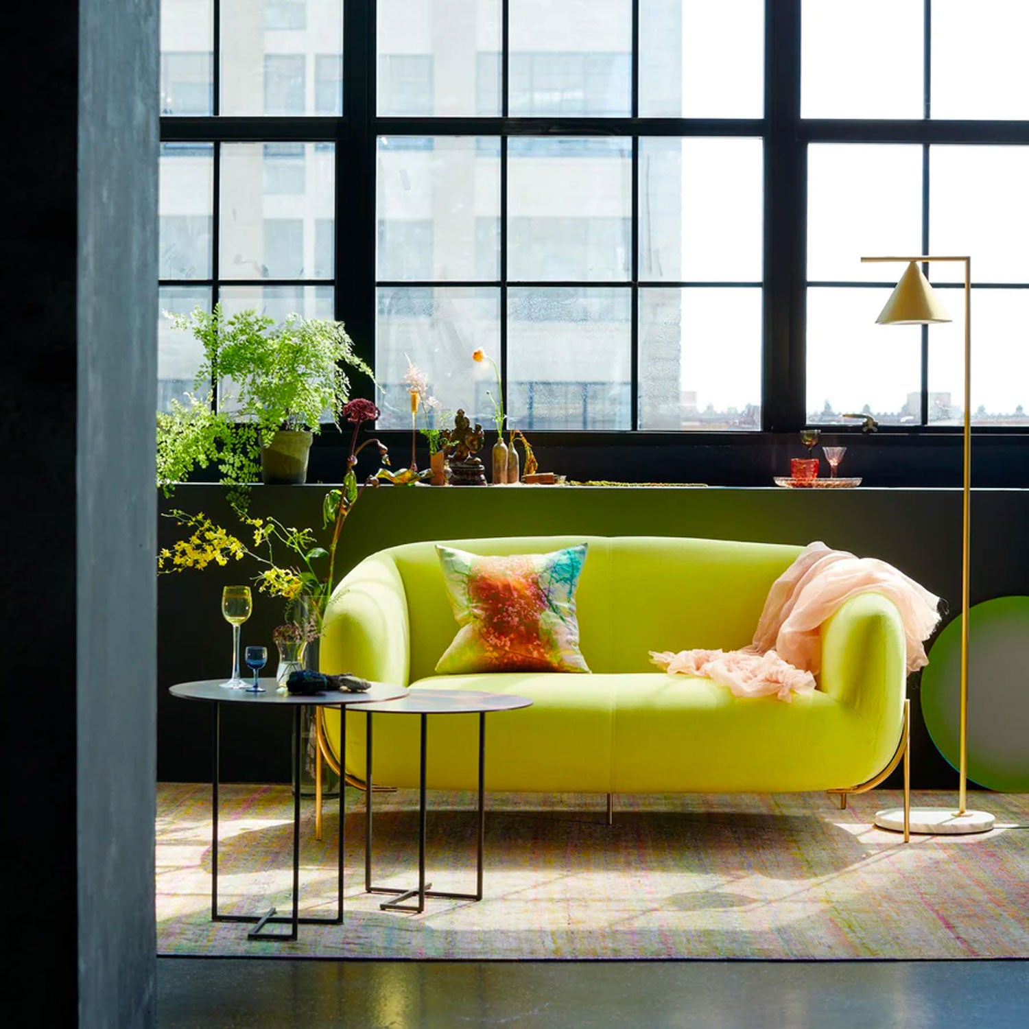 A modern urban living space with vibrant lime green sofa.