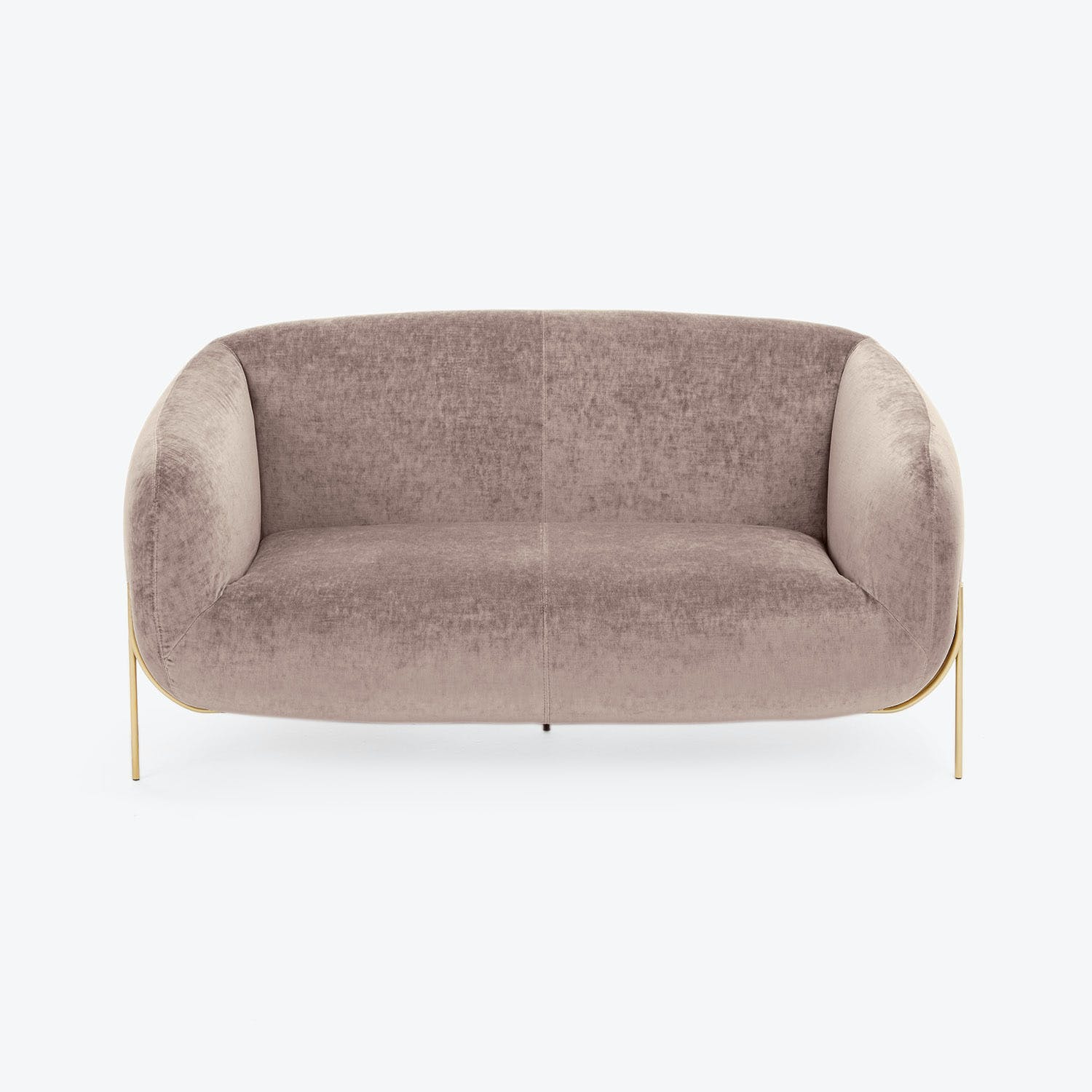 Minimalist modern sofa in blush-tone upholstery exudes elegance and comfort.