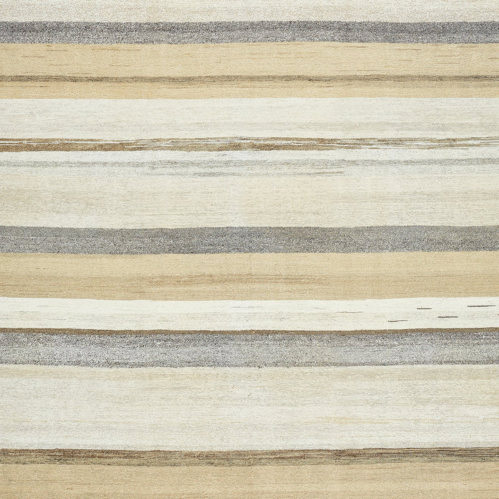 Textured surface with horizontal bands of beige, grey, and brown.