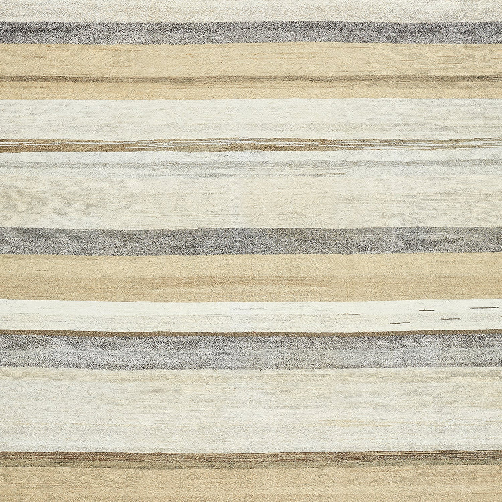 Textured surface with horizontal bands of beige, grey, and brown.