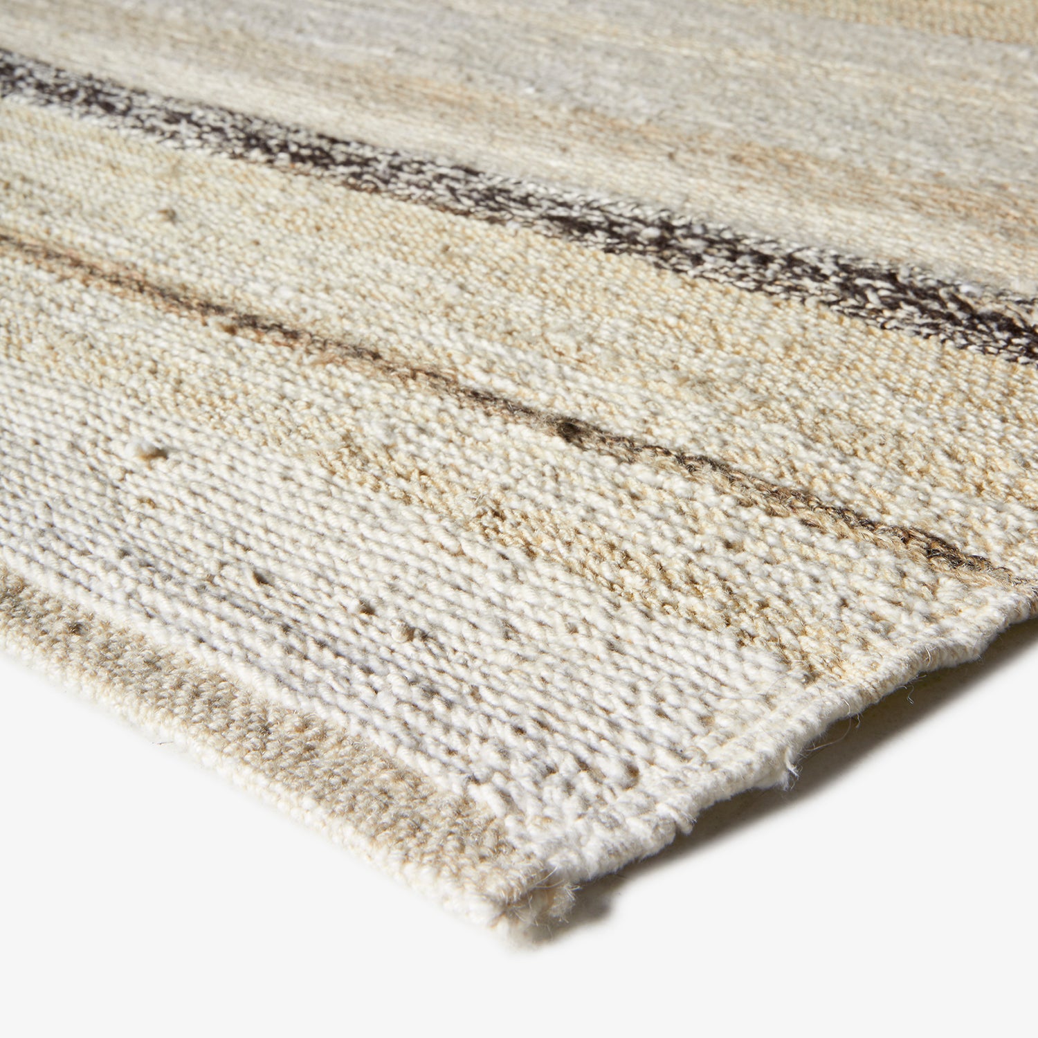 Cream and off-white textured fabric with dark linear elements.