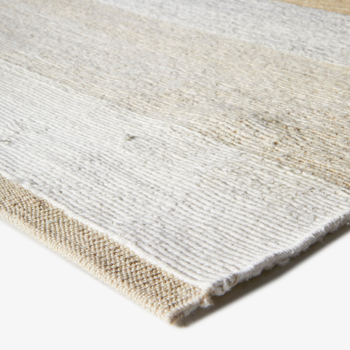 Close-up of a white textured rug showcasing its intricate weave.