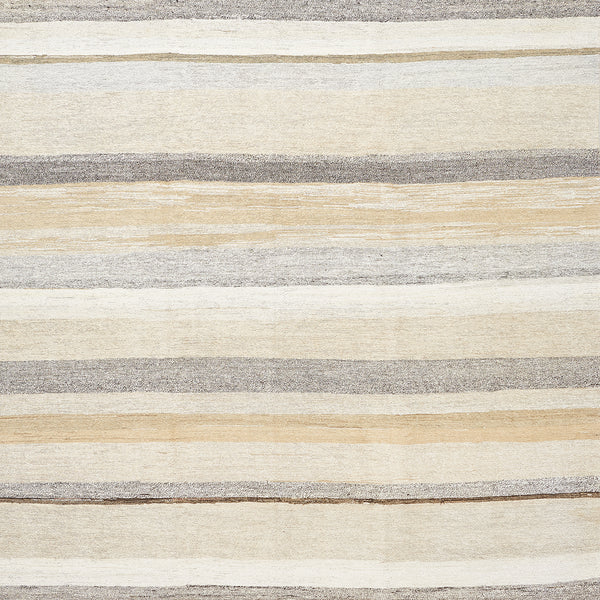 Close-up of textured material with horizontal stripes in neutral colors.