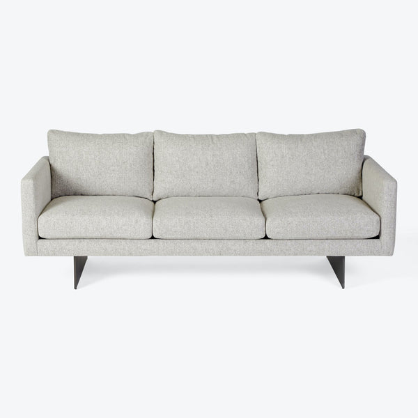 Modern three-seater sofa with clean lines and sleek design.