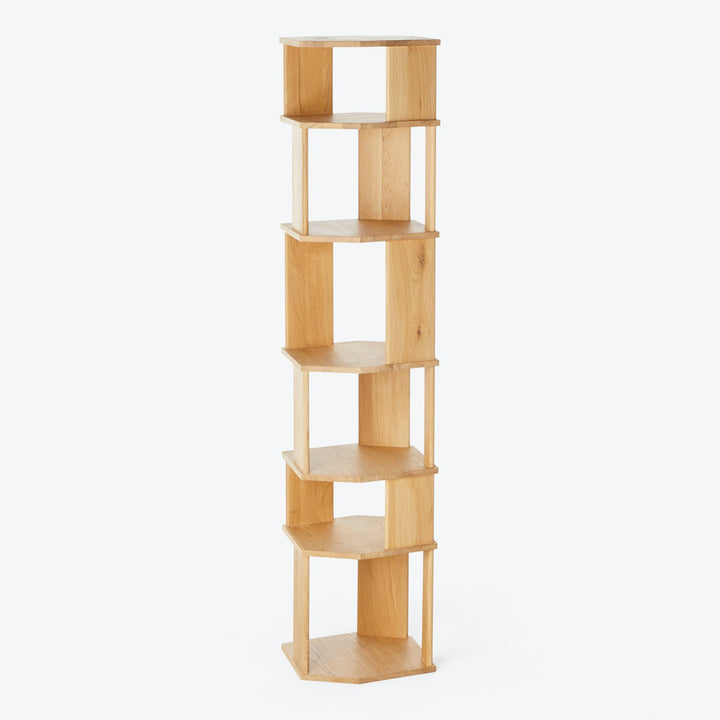 Modern freestanding corner shelf with light wood finish and zigzag design.