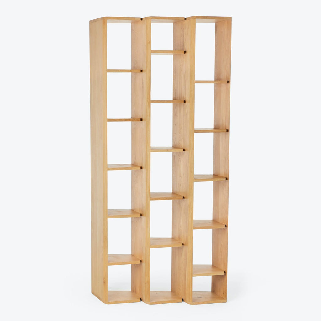 Minimalist wooden bookshelf with grid-like compartments, ready for customization.