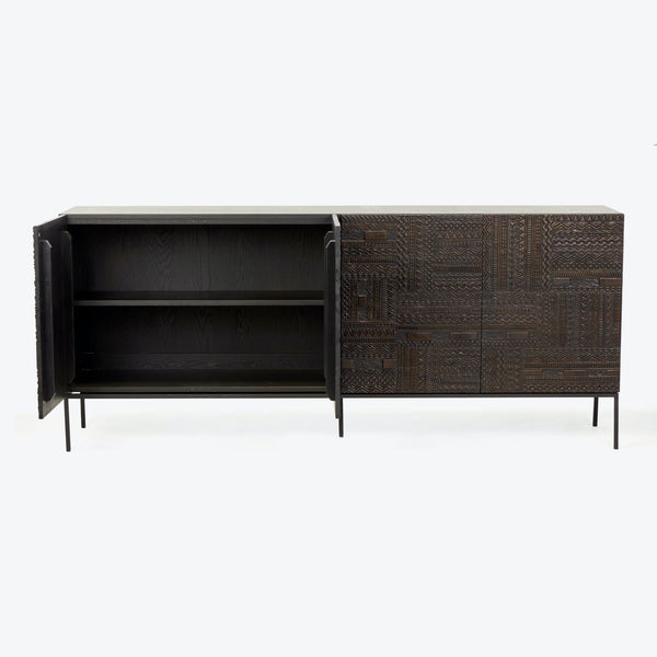 Modern sideboard with open shelving, decorative patterned doors, and sleek legs.