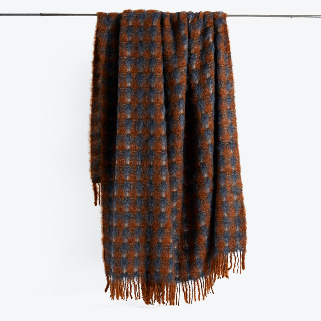 Classic checkered scarf with fringed edge, perfect for cold weather.