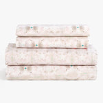 Neatly folded confetti patterned textiles demonstrate tidiness and organization.