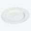 Ornate white ceramic plate with embossed floral design and scalloped edge