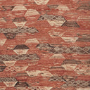 Close-up of a textured fabric with hexagonal and triangular patterns.