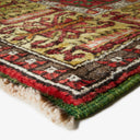 Close-up view of a vibrant, intricately patterned traditional rug or carpet.