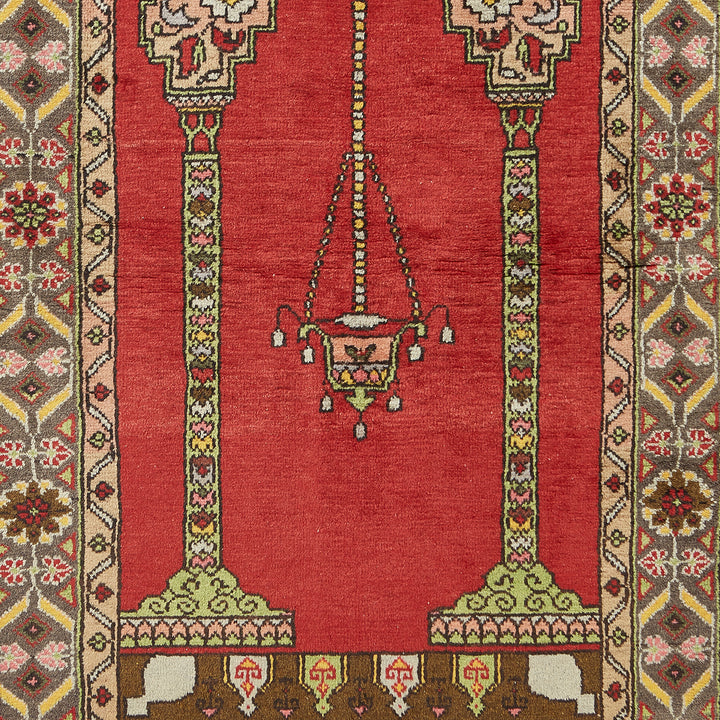 Close-up of a intricately designed rug with chandelier-like pattern