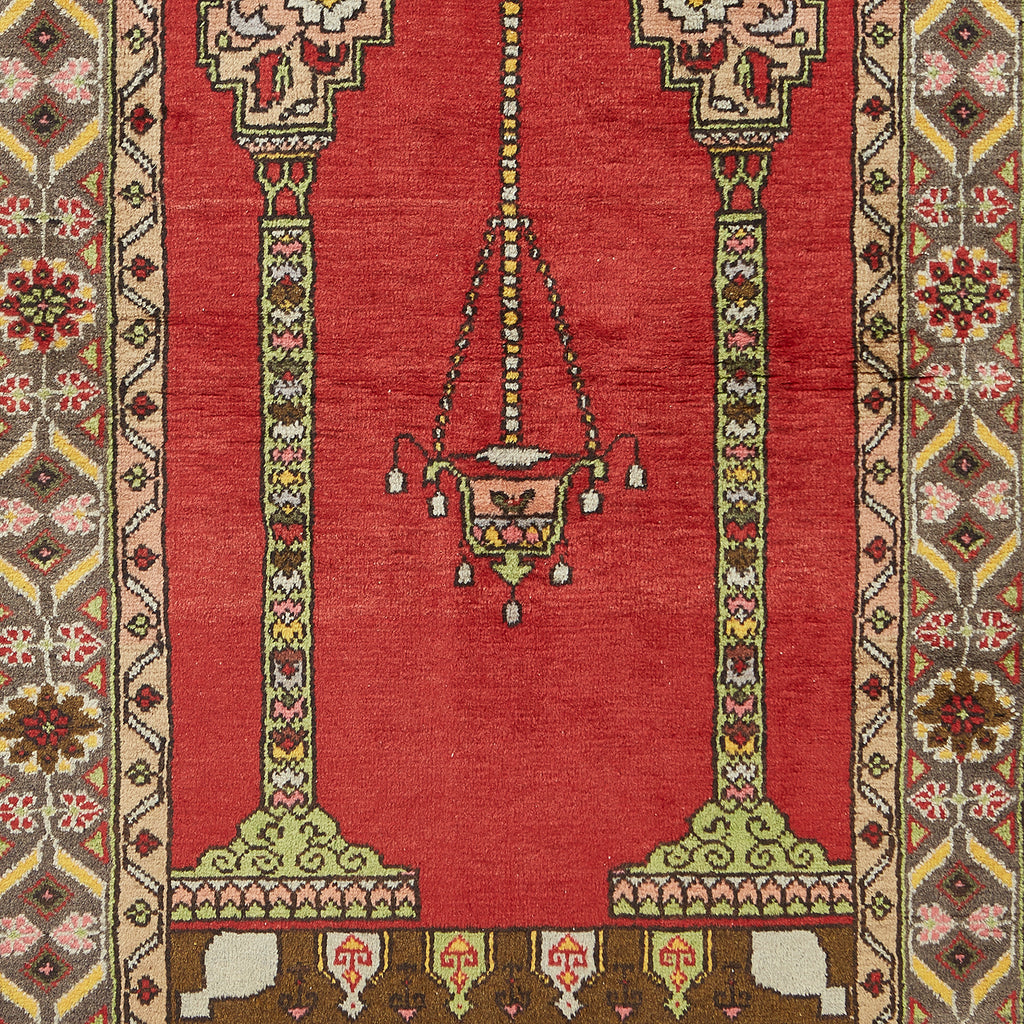 Close-up of a intricately designed rug with chandelier-like pattern