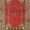 Close-up of a intricately designed rug with chandelier-like pattern