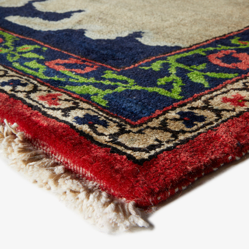 Close-up of an ornate, traditional rug with intricate patterns.