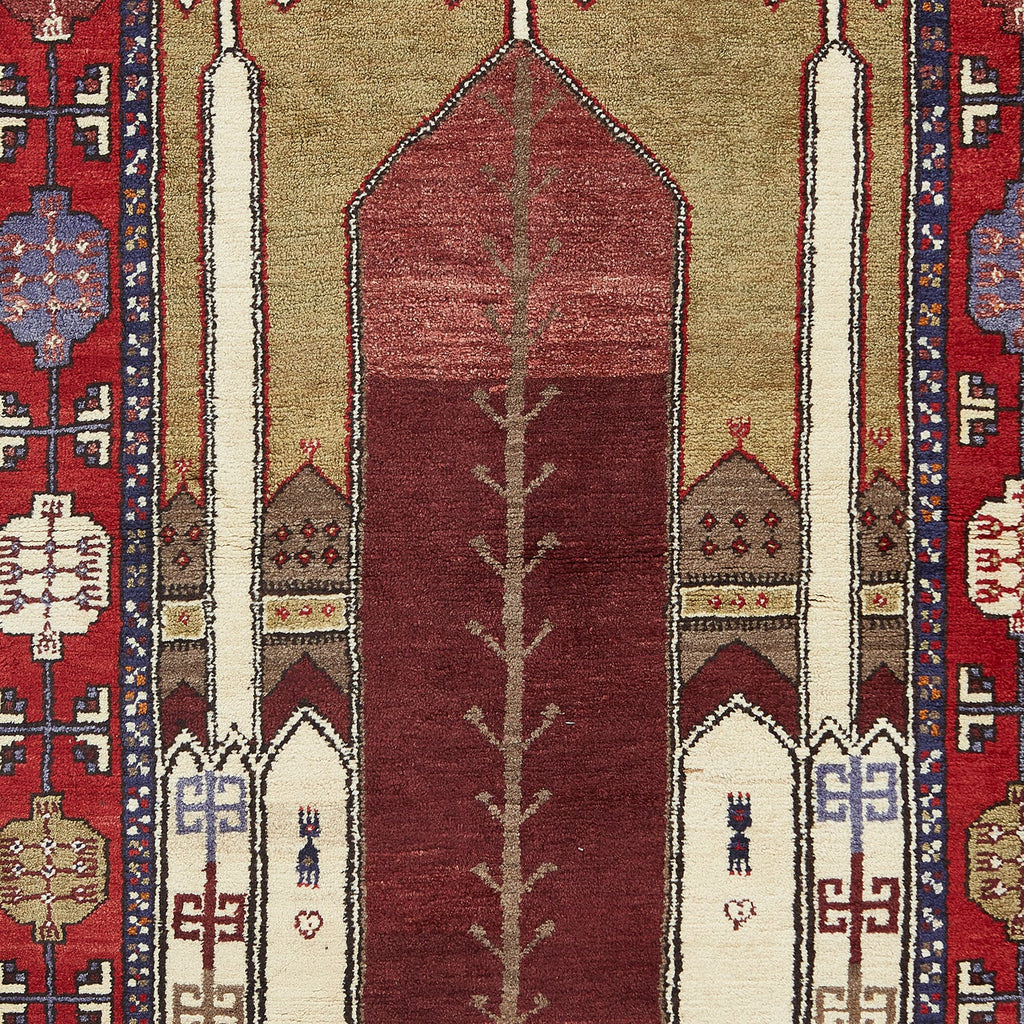 Traditional handwoven Persian rug with intricate geometric motifs and vibrant colors.