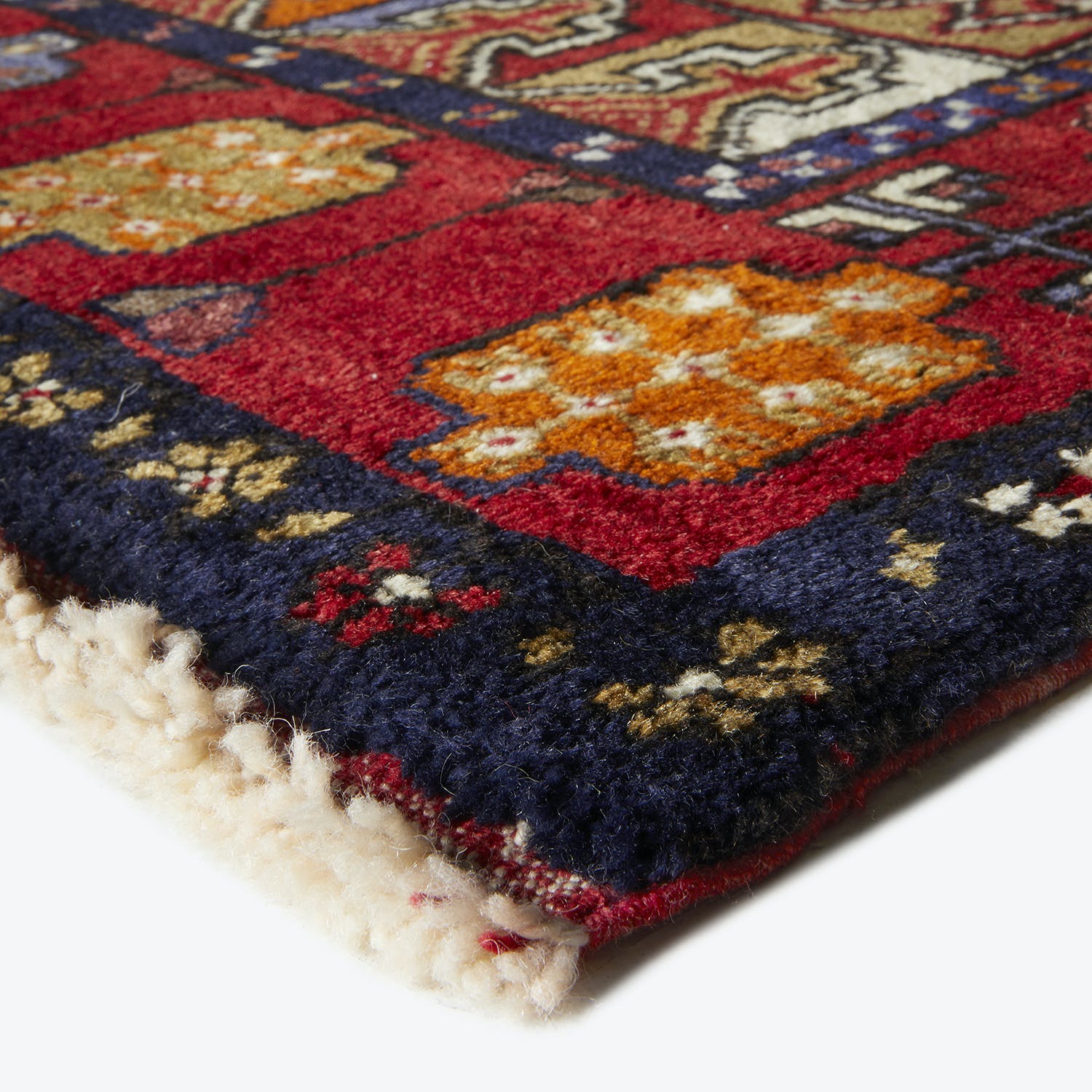 Vibrant, handcrafted rug showcases intricate patterns in rich colors.