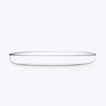 Clear glass pie dish on white background, classic design.