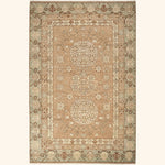 An intricately designed traditional rug with symmetrical medallion patterns.