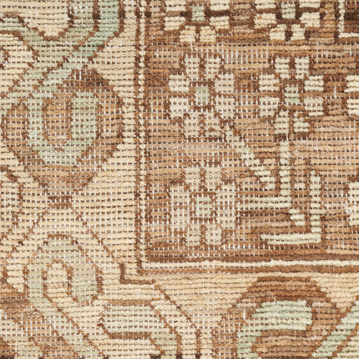 Close-up of a meticulously woven textile with intricate traditional motifs.