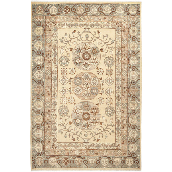Traditional rug with intricate floral and geometric design in earth tones.