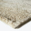 Plush, creamy beige carpet with dense texture and fluffy appearance.