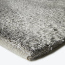 Close-up of plush gray rug showcasing its soft texture.