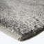 Close-up of plush gray rug showcasing its soft texture.