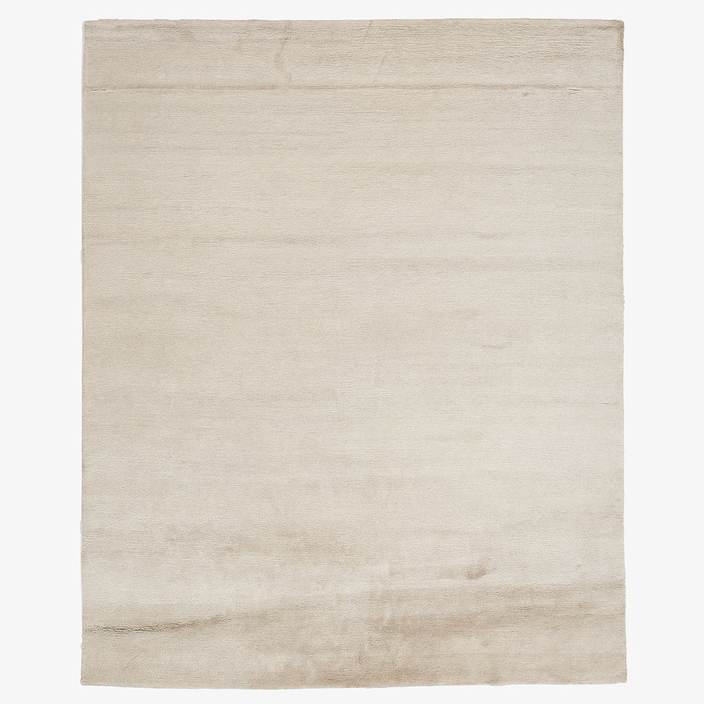 Versatile and elegant, a minimalistic cream rug adds sophistication to any space.